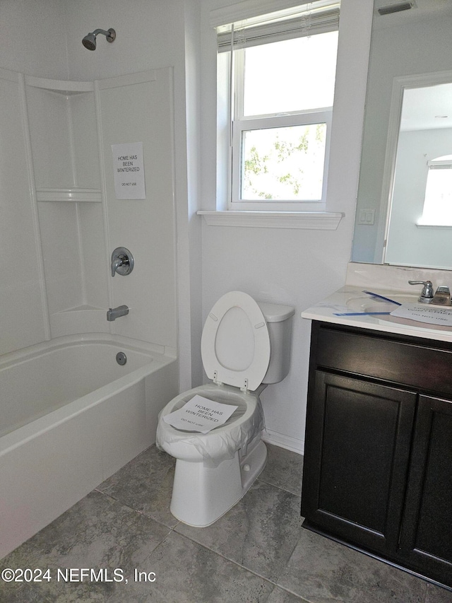 full bathroom with vanity, toilet, tile patterned floors, and tub / shower combination