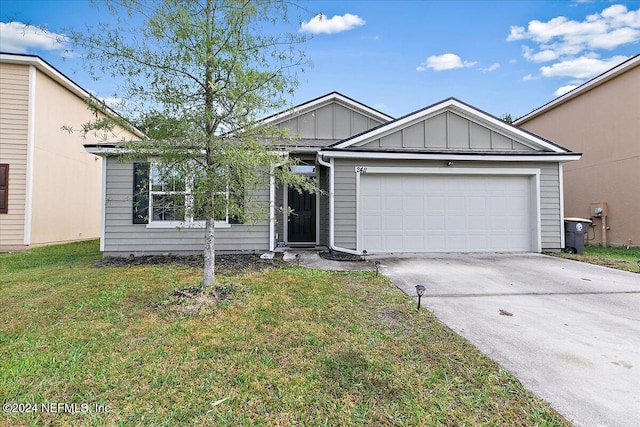 view of front facade with a front lawn and a garage