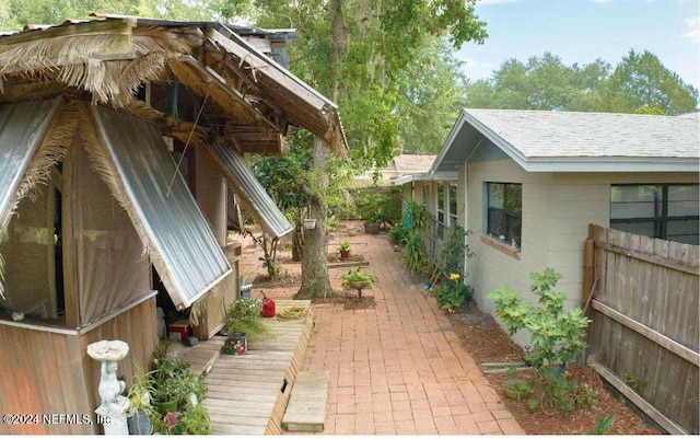 view of home's exterior featuring a wooden deck