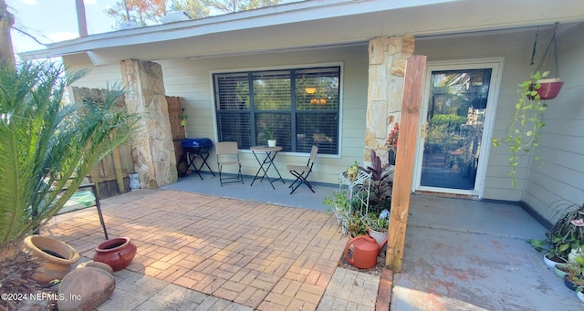 entrance to property featuring a patio