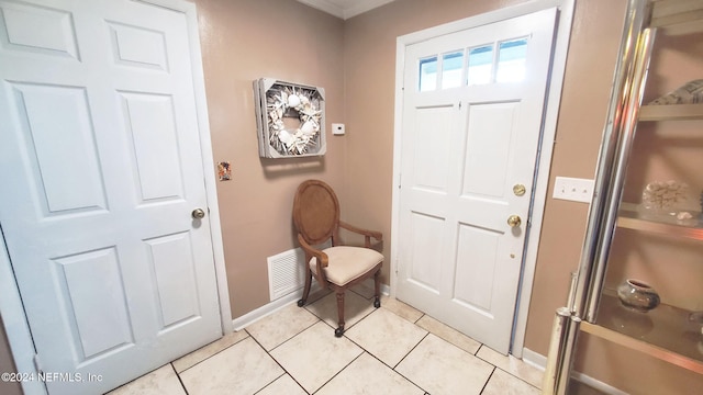 foyer entrance with light tile patterned flooring