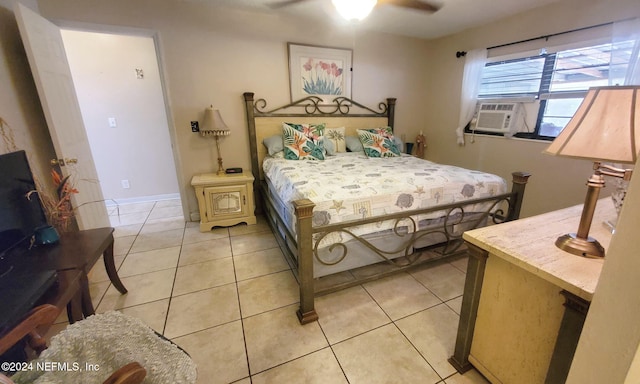 tiled bedroom featuring ceiling fan and cooling unit