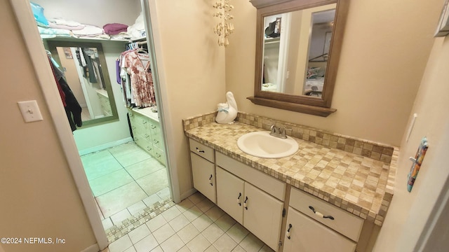 bathroom with vanity, tile patterned floors, and decorative backsplash