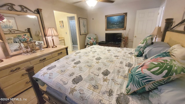 bedroom with connected bathroom and ceiling fan