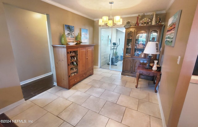 dining area featuring ornamental molding, light tile patterned flooring, and a notable chandelier