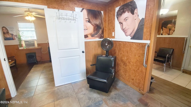 sitting room with ceiling fan and cooling unit