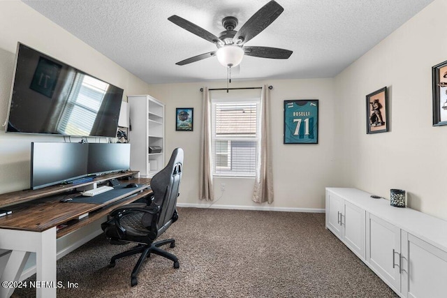 carpeted office space with ceiling fan and a textured ceiling