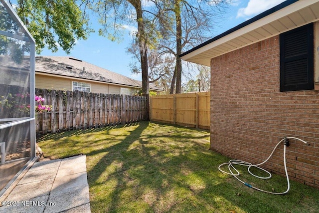 view of yard featuring a fenced backyard