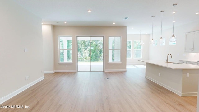 345 Palomar Dr, Saint Johns, FL 32259 - unfurnished living room featuring light wood-style floors and recessed lighting