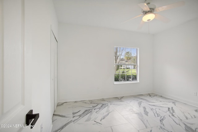 unfurnished room with ceiling fan