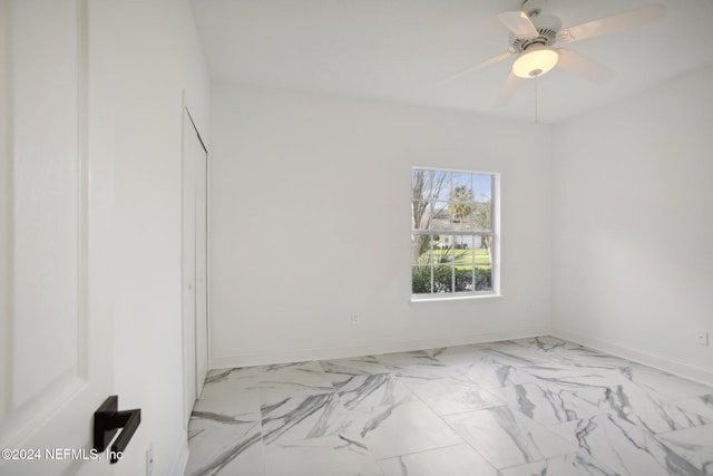 2693 Seneca Dr, Saint Johns, FL 32259 - unfurnished room featuring light marble finish floors, baseboards, and a ceiling fan