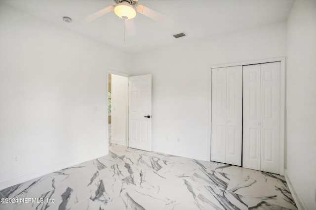 unfurnished bedroom featuring a closet and ceiling fan