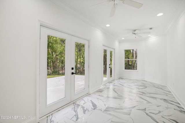 empty room with french doors, ceiling fan, and ornamental molding