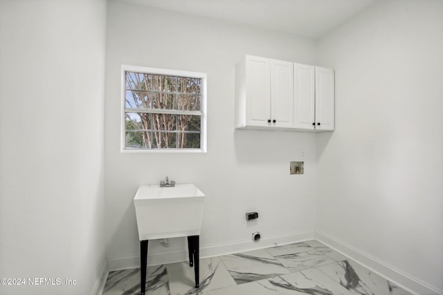 2693 Seneca Dr, Saint Johns, FL 32259 - washroom featuring cabinet space, baseboards, hookup for a washing machine, and light marble finish flooring