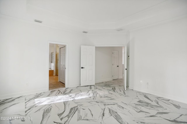 unfurnished bedroom featuring crown molding