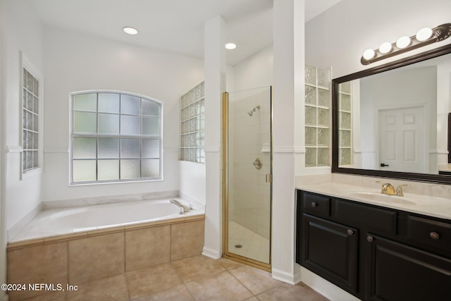 bathroom with vanity, tile patterned floors, and separate shower and tub