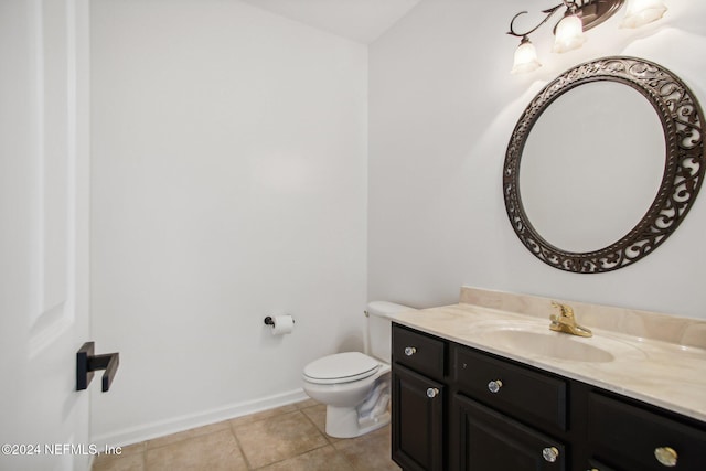 bathroom featuring vanity, toilet, and tile patterned flooring