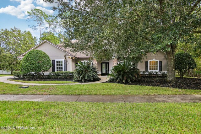 2693 Seneca Dr, Saint Johns, FL 32259 - obstructed view of property featuring stucco siding and a front yard