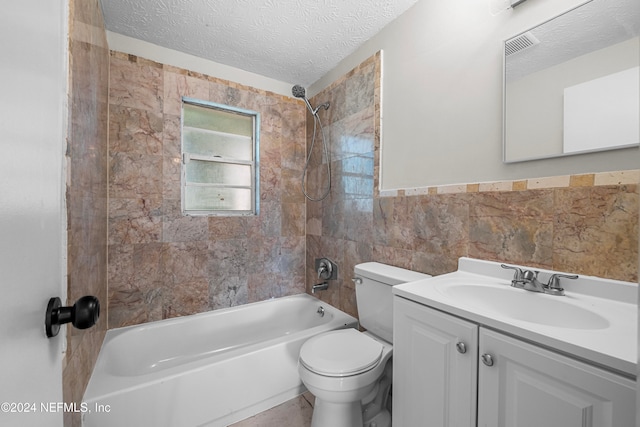 full bathroom with a textured ceiling, toilet, tile walls, vanity, and tiled shower / bath combo