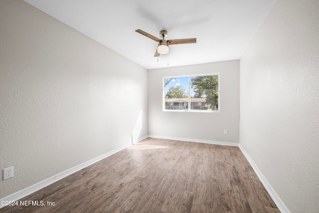 unfurnished room featuring light wood-type flooring and ceiling fan