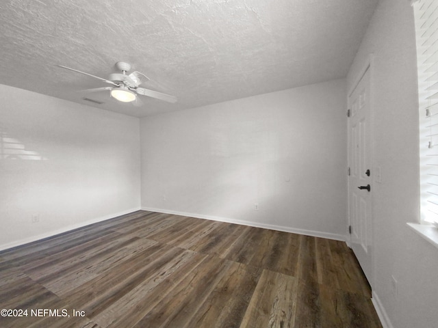 unfurnished room featuring a textured ceiling, ceiling fan, and dark hardwood / wood-style flooring