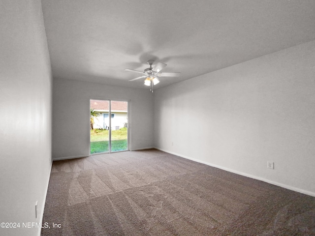 spare room featuring carpet floors and ceiling fan