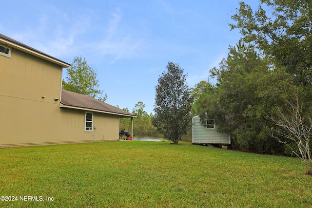 view of yard with a water view