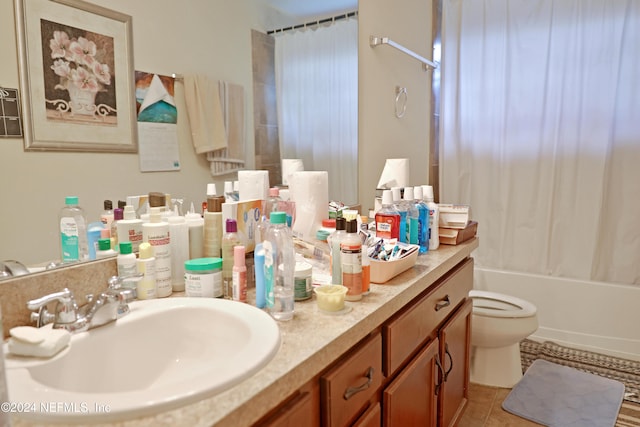 full bathroom with vanity, shower / tub combo with curtain, tile patterned flooring, and toilet