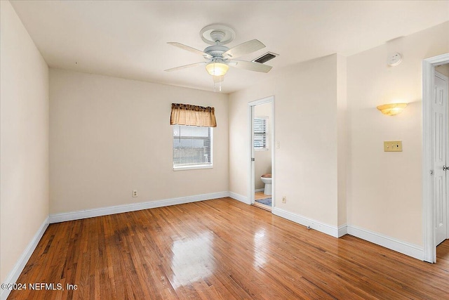 empty room featuring hardwood / wood-style flooring and ceiling fan