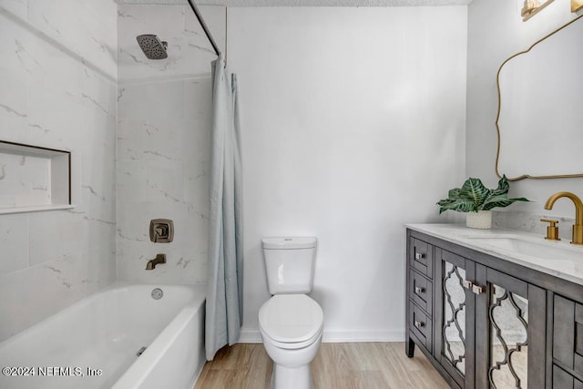 full bathroom with hardwood / wood-style flooring, vanity, toilet, and shower / bath combination with curtain