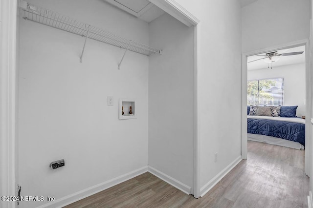 clothes washing area featuring ceiling fan, washer hookup, wood-type flooring, and hookup for an electric dryer