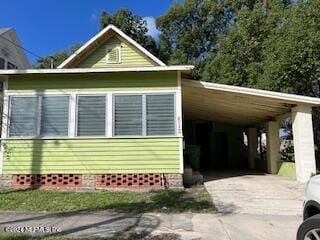 view of property exterior featuring a carport