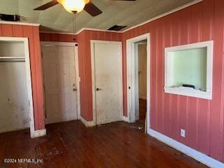 unfurnished bedroom with ceiling fan and dark hardwood / wood-style flooring