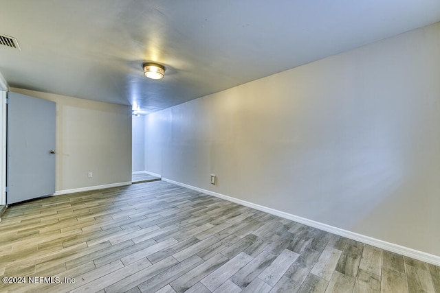 spare room featuring light hardwood / wood-style flooring