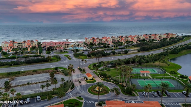 aerial view at dusk with a water view