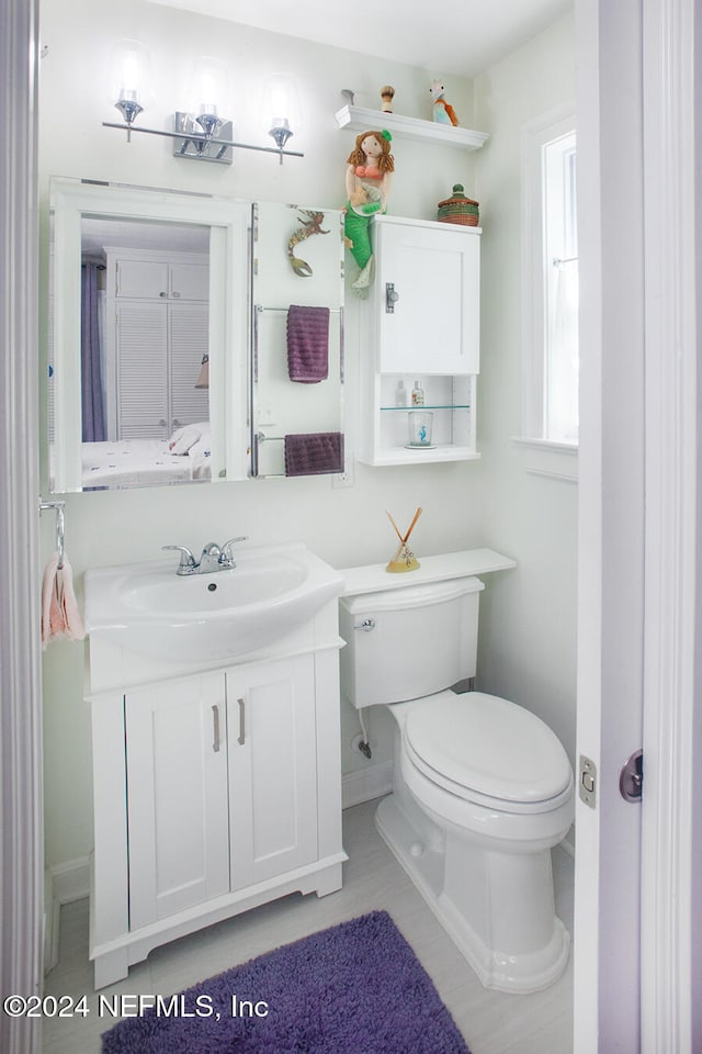 bathroom with vanity and toilet