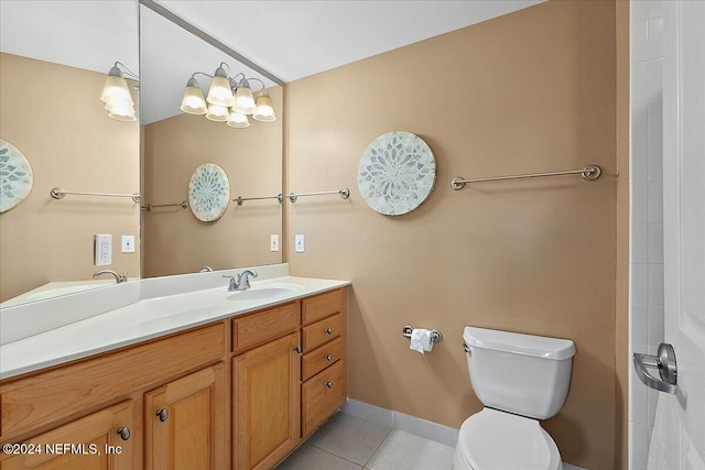 bathroom with vanity, toilet, and tile patterned floors