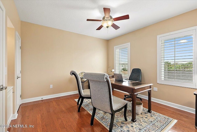 office area featuring a textured ceiling, hardwood / wood-style flooring, and ceiling fan