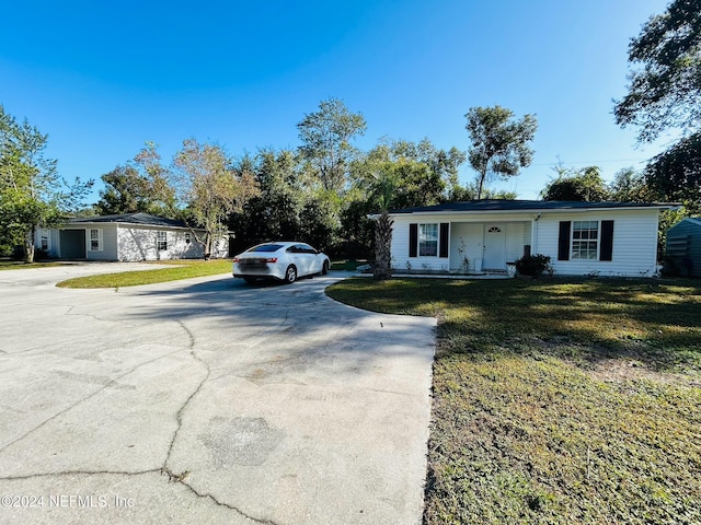 ranch-style home with a front yard