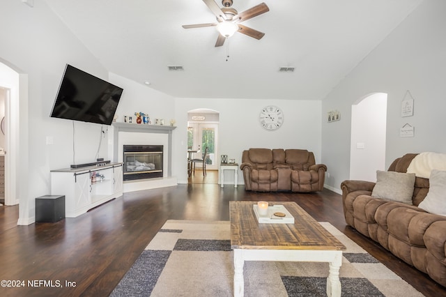 living room featuring ceiling fan, lofted ceiling, and dark hardwood / wood-style floors