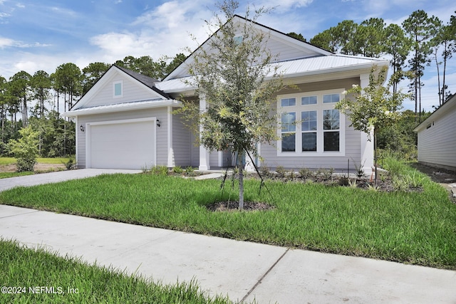 view of front facade featuring a front yard and a garage