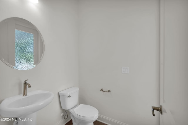 bathroom with sink and toilet