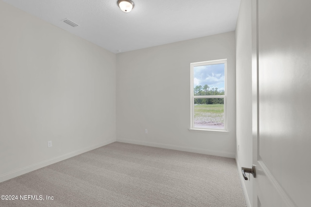 empty room with carpet flooring