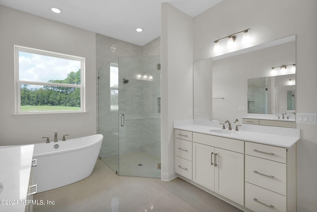 bathroom featuring vanity and plus walk in shower