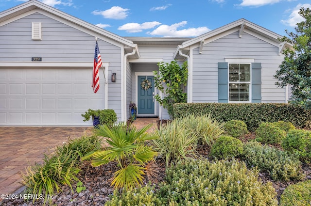 ranch-style home with a garage