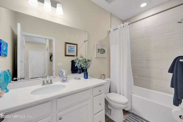 full bathroom featuring toilet, shower / tub combo, and vanity