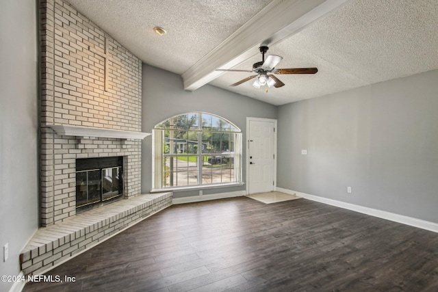 unfurnished living room with wood-type flooring, a brick fireplace, and a textured ceiling