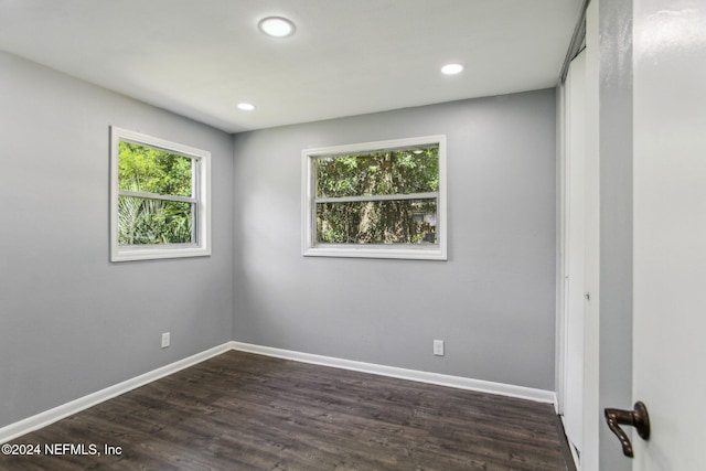 spare room featuring dark hardwood / wood-style floors