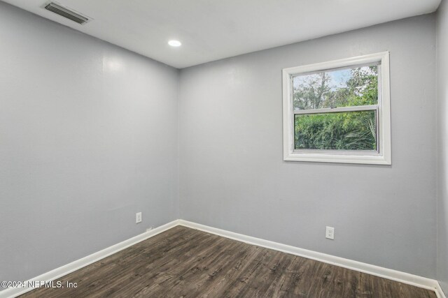 empty room with wood-type flooring