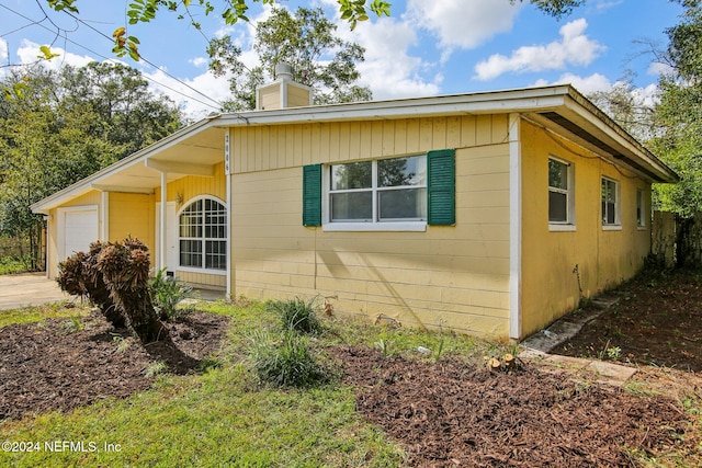 view of home's exterior with a garage